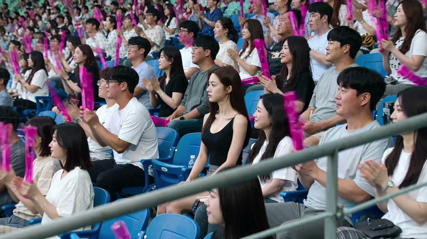 Shy Smile of the Baseball Crowd