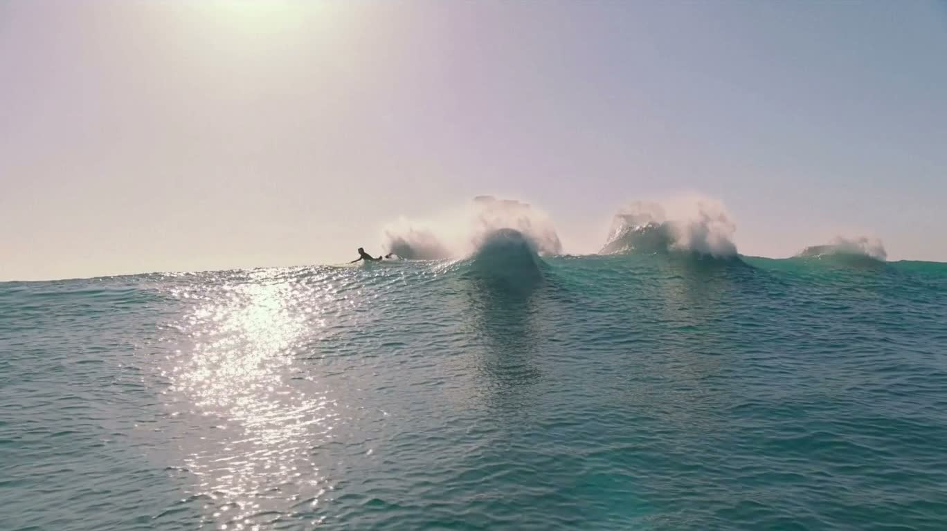 Surreal Surfer Between the Tides