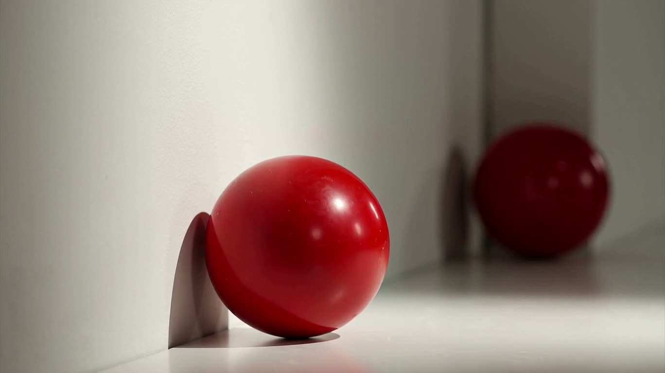 Quả cầu đỏ nghiêng nhẹ — AI video creation